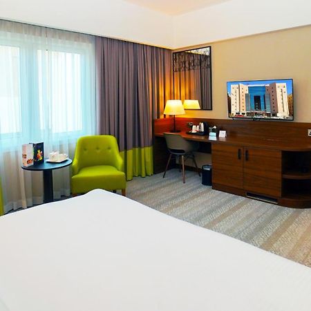 The Grand Lux Hotel Доха Екстериор снимка A room at the hotel