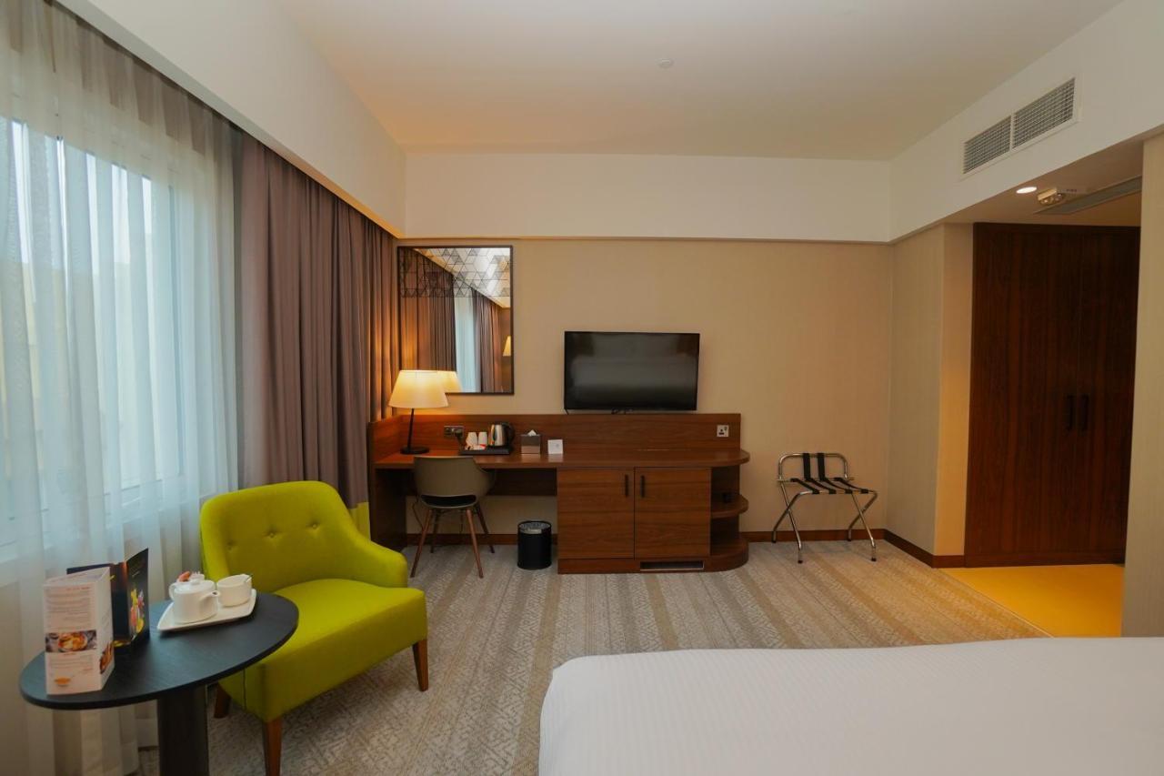 The Grand Lux Hotel Доха Екстериор снимка A room at the hotel