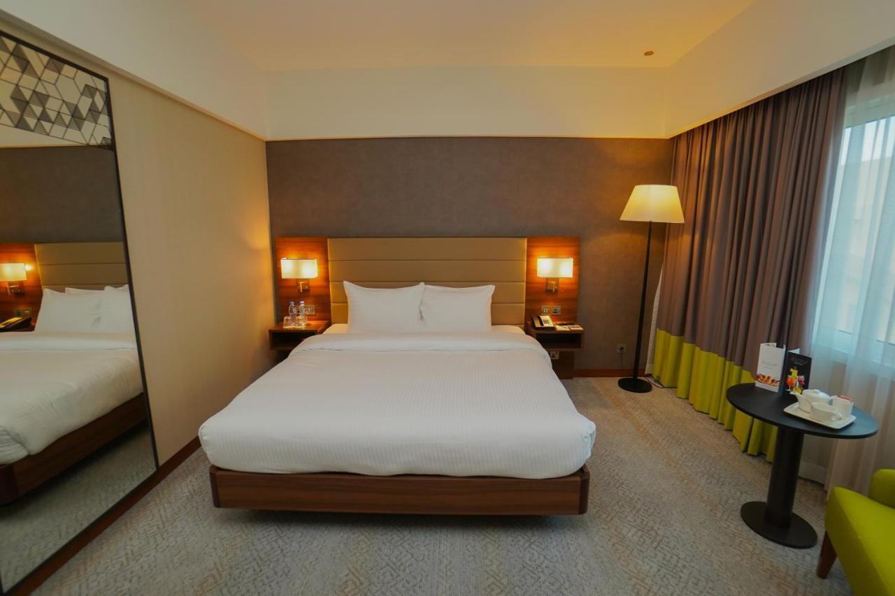 The Grand Lux Hotel Доха Екстериор снимка A room at the hotel