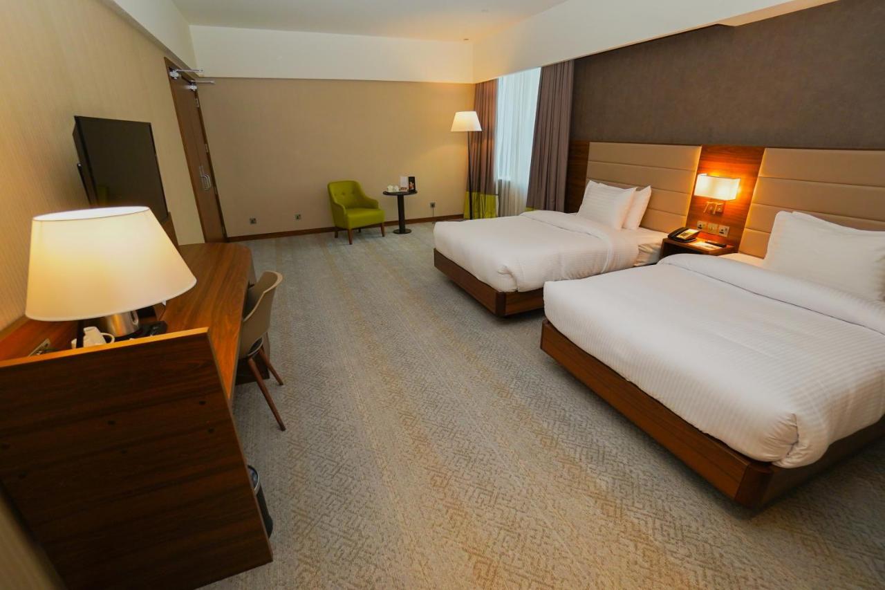 The Grand Lux Hotel Доха Екстериор снимка A room at the hotel