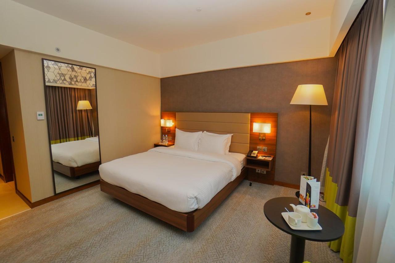 The Grand Lux Hotel Доха Екстериор снимка A room at the hotel