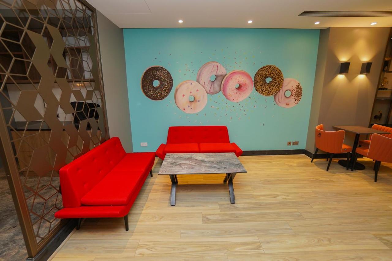 The Grand Lux Hotel Доха Екстериор снимка The interior of a Dunkin' Donuts in Paris, France