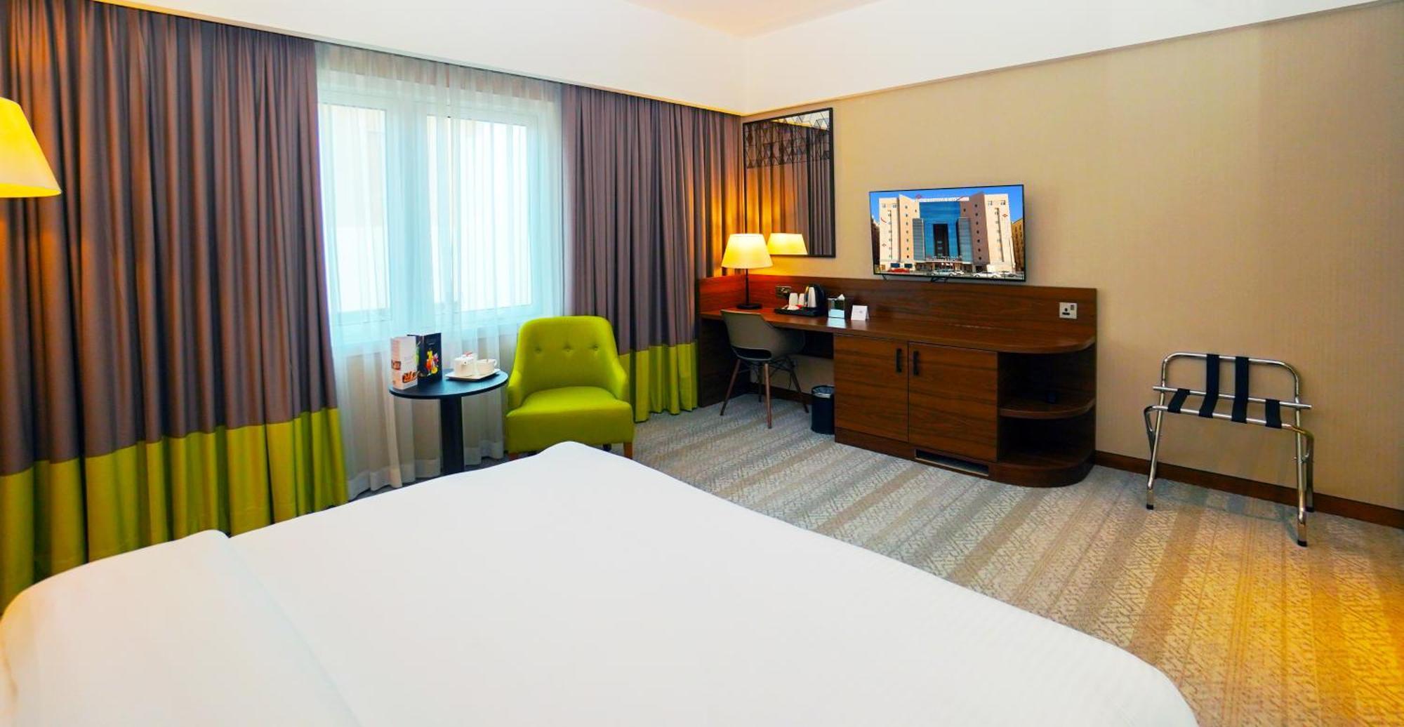The Grand Lux Hotel Доха Екстериор снимка A room at the hotel